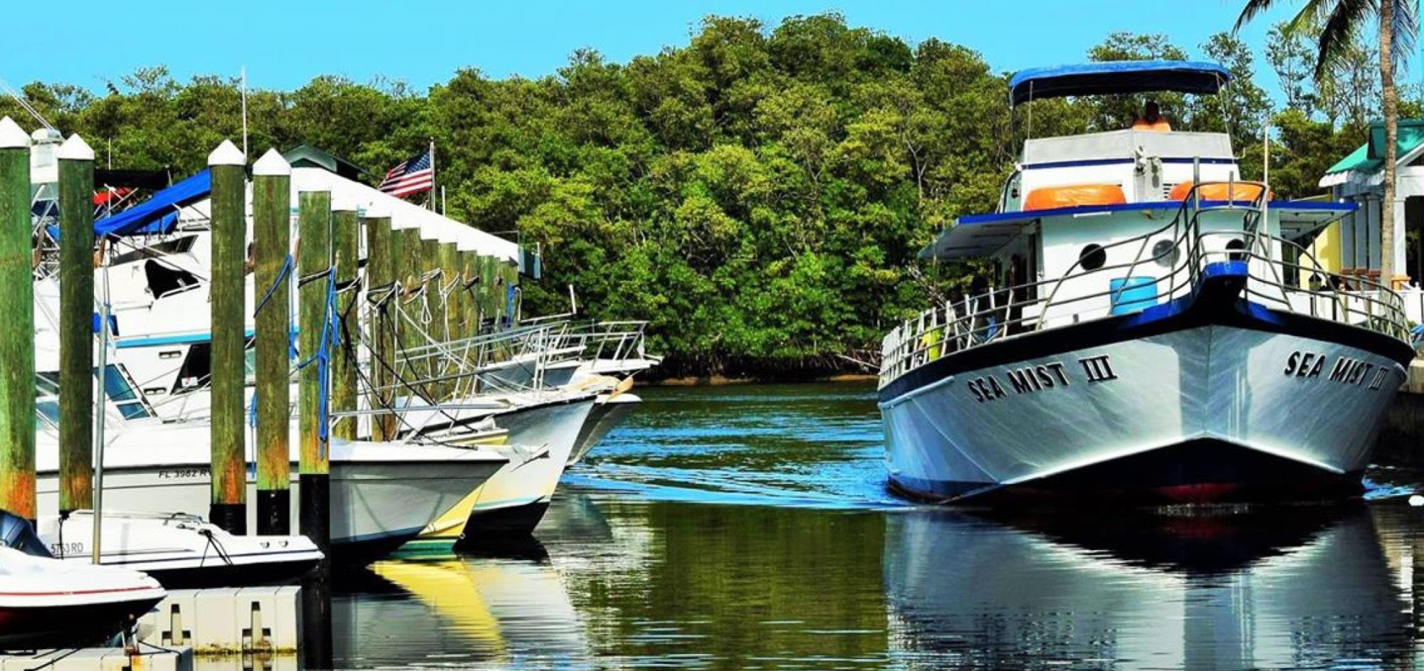 Boat entering the Boynton Harbor Marina Boat Slips